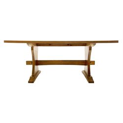 'Squirrelman' oak dining table, rectangular adzed top, shaped end supports on sledge feet joined by pegged stretcher, by Wilf Hutchinson of Husthwaite 