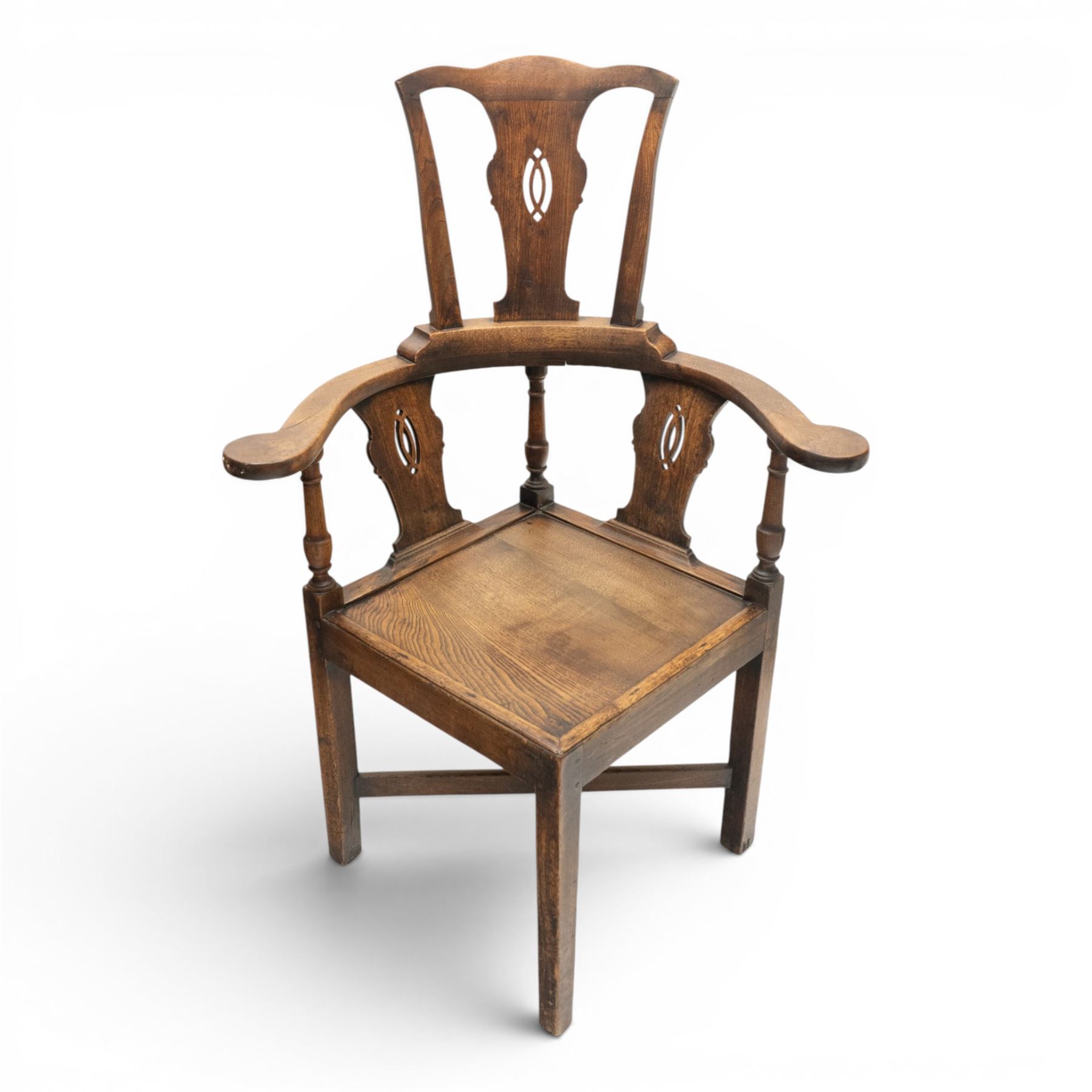 19th century elm high-backed corner chair, shaped cresting rail over three pierced vasiform splats and out-swept arms, square panelled seat over square supports united by X-stretcher