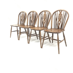 Set four oak wheel back dining chairs