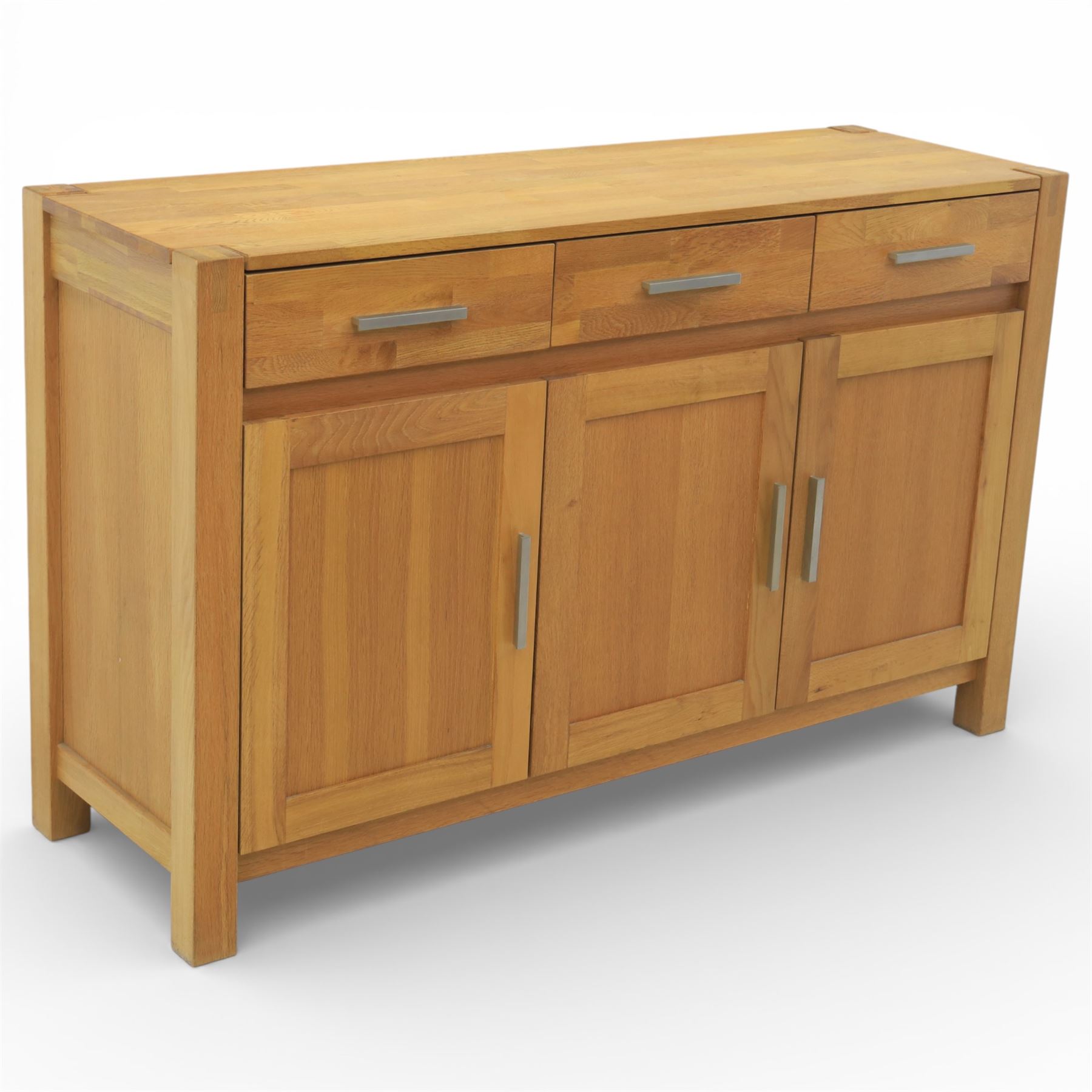 Solid light oak sideboard, fitted with three drawers and three cupboards