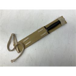 Gulf War period commando knife with 17cm double-edged steel blade etched with the crest and motto 'By Strength and Guile', blackened cross-piece and grip; in webbing scabbard L31cm overall