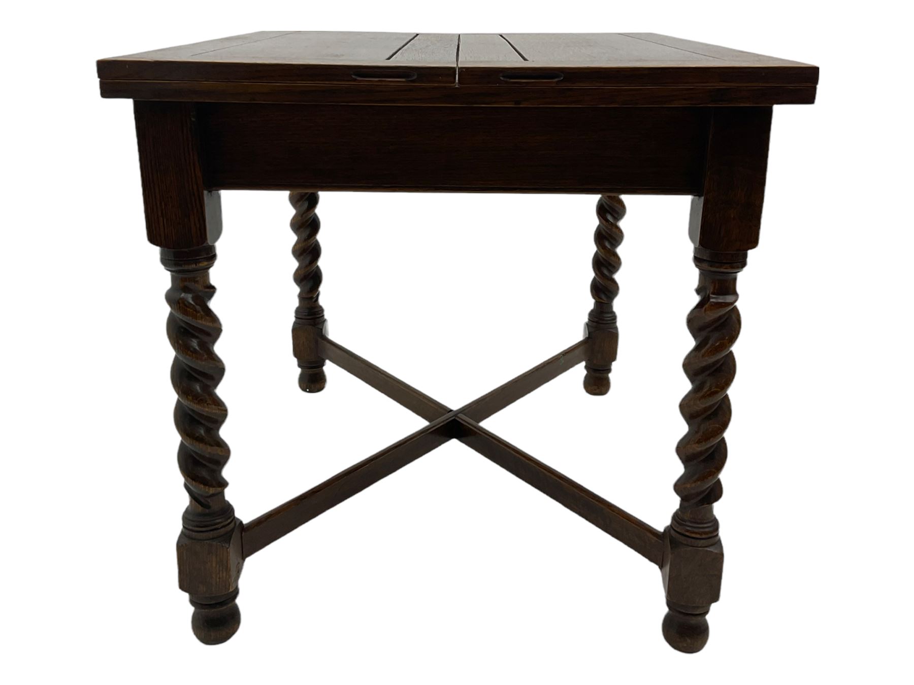 Early 20th century oak barley twist extending table, two fold-over leaves with pull-out stays, spiral turned supports joined by x-stretchers
