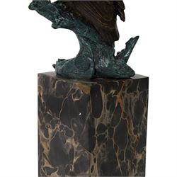 Cold painted bronze figure, modelled as an owl perched upon a tree stump signed Milo and with foundry mark, raised upon black veined marble plinth, H27.5cm