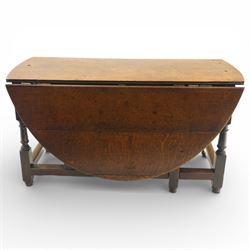 18th century large oak gateleg table, of plank top construction with visible dowels, with drop leaves to form an oval table 167cm in width, raised on block and turned supports