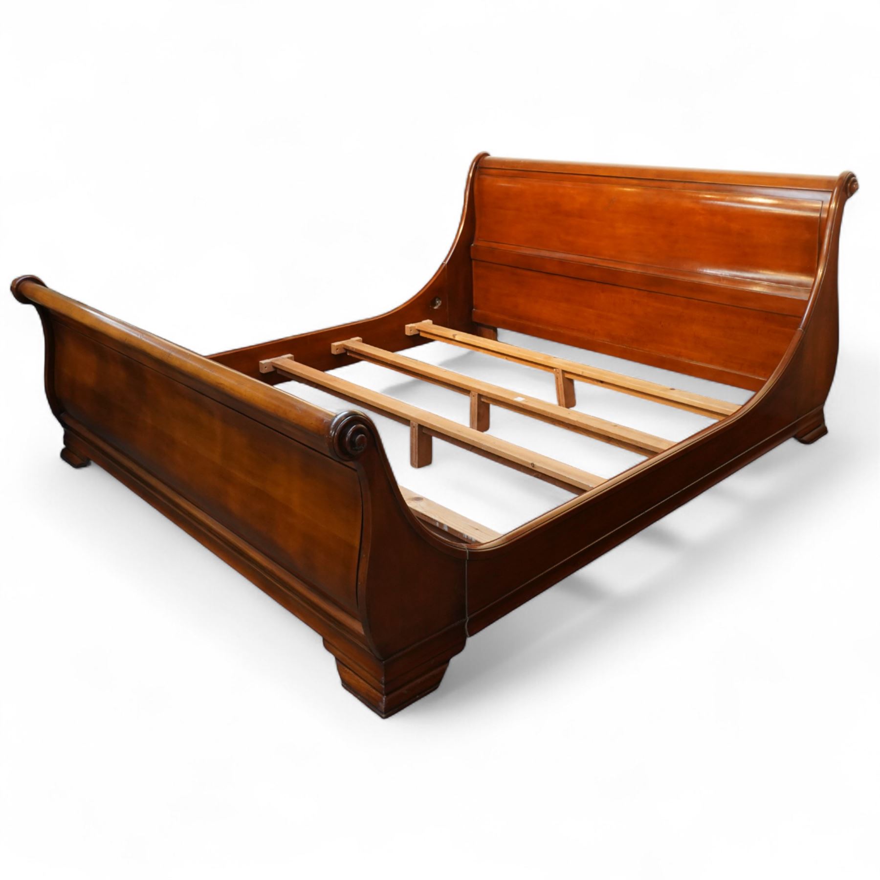 And So To Bed - Super King 'Manoir' 6' sleigh bed, the panelled headboard and footboard with pronounced scrolled ends, stepped moulded rails and shaped side panels, on block feet