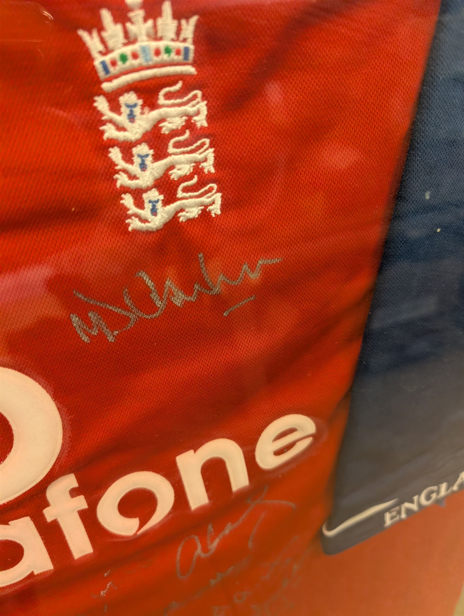 Cricket memorabilia: signed cricket bat from John Childs Benefit year 1994, and two framed England cricket shirts both with signatures, largest frame H95cm