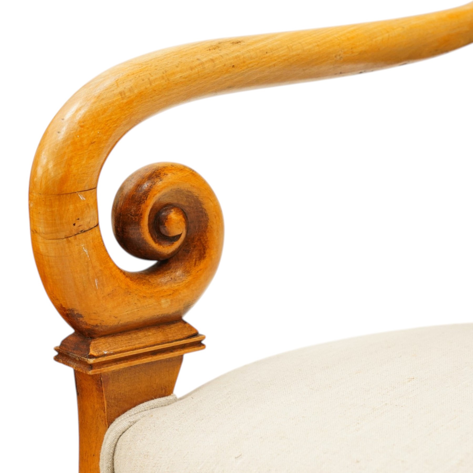 Pair of French Empire design fauteuil armchairs, high back over scrolled arm terminals, upholstered in cream fabric, on scroll carved cabriole supports