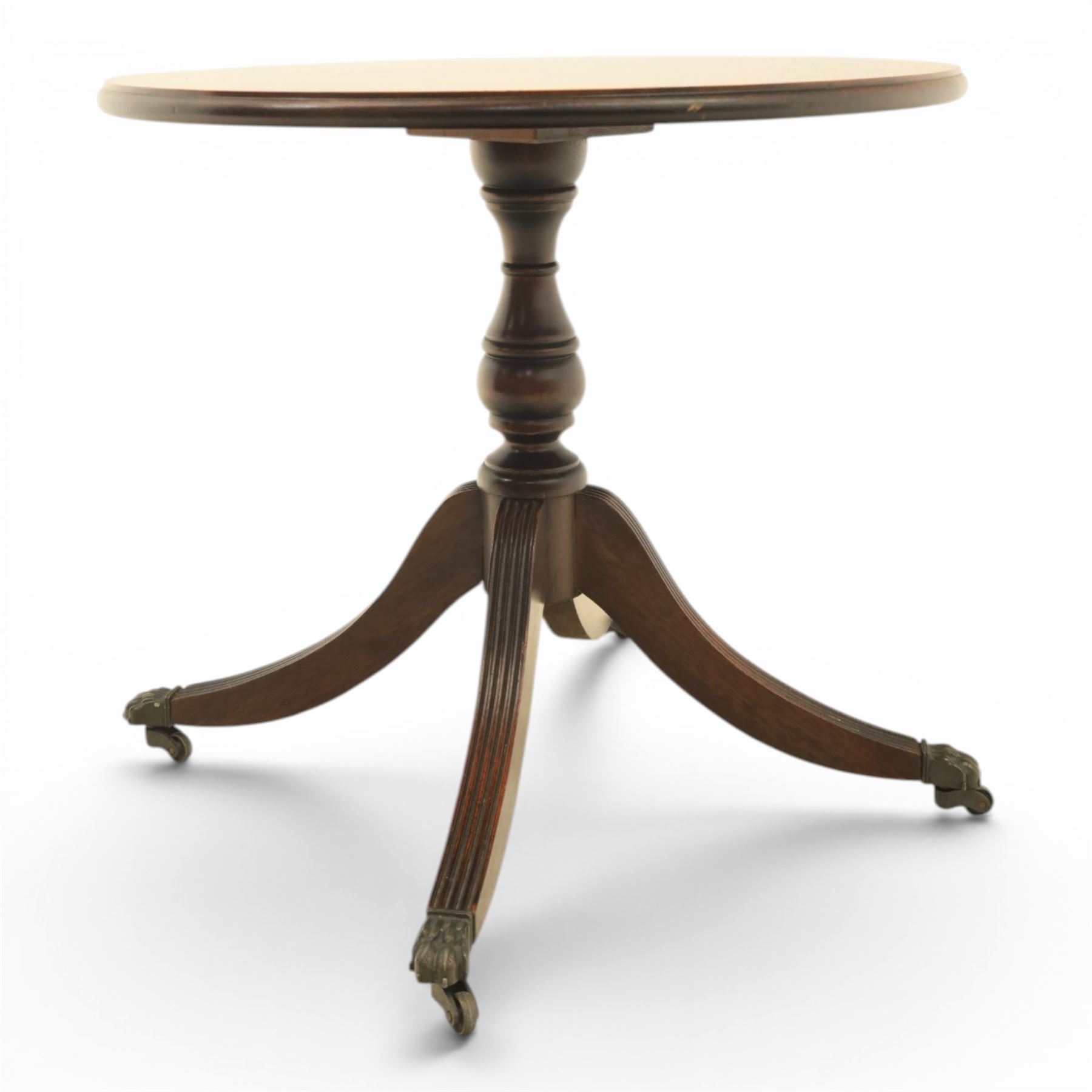 Pair of Georgian design flame mahogany wine tables, circular book-matched veneered tops with moulded edges, on turned pedestals and four reeded downswept supports terminating in brass caps and castors