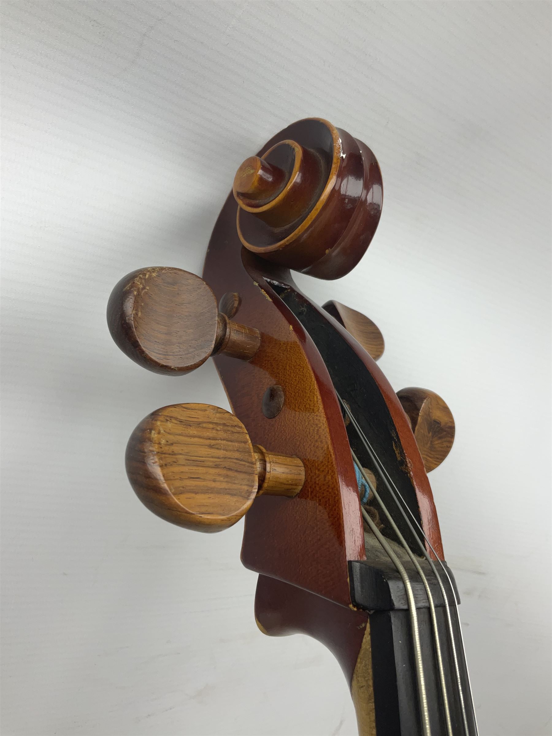 Two student half-size cellos - Boosey & Hawkes Artia with 65cm one-piece back and spruce top; bears maker's label; L104cm overall; and Romanian with 65.5cm two-piece maple back and ribs and spruce top; bears label; L108.5cm overall; each in soft carrying case with two bows (2)