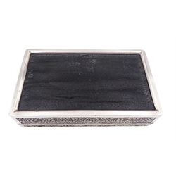 Indian silver cigarette box, of rectangular form with chassed and embossed foliate decoration and vacant rectangular panel to hinged cover, opening to reveal softwood lined interior with division, H3.3cm W14.3cm D8.5cm, stamped Silver VR Co with elephant mark