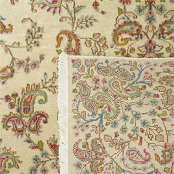 Persian Isfahan cream ground rug, overall floral design, sparse field decoration with trailing flower head and Boteh motifs, repeating floral pattern boarder with repeating motifs 
