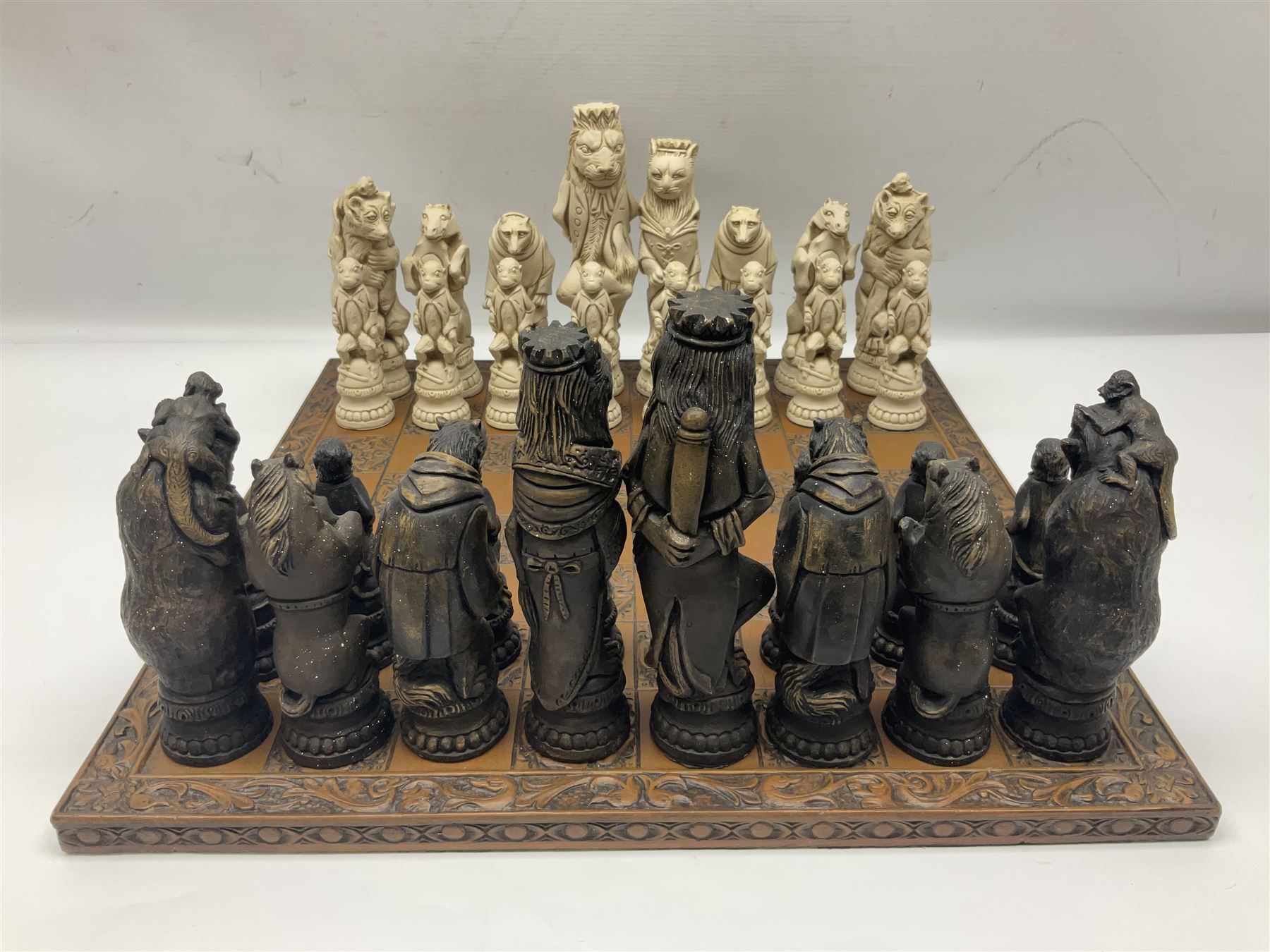 Chess set and resin chess pieces moulded as various animals, the pawns as monkeys, Kings as lions etc, board L46cm, W46cm, king H19cm