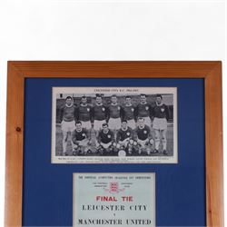 F.A. Cup Final Wembley 1963 Leicester City V Manchester United match programme, displayed in a wooden glazed frame with a black and white photograph of the 1962-63 Leicester City team and the team line up and player profiles pages from the programme, frame H73cm

Notes: The 1963 F.A. Cup final was played on 25 May 1963 at Wembley 'Empire' Stadium. The final was won by Manchester United 3-1. 