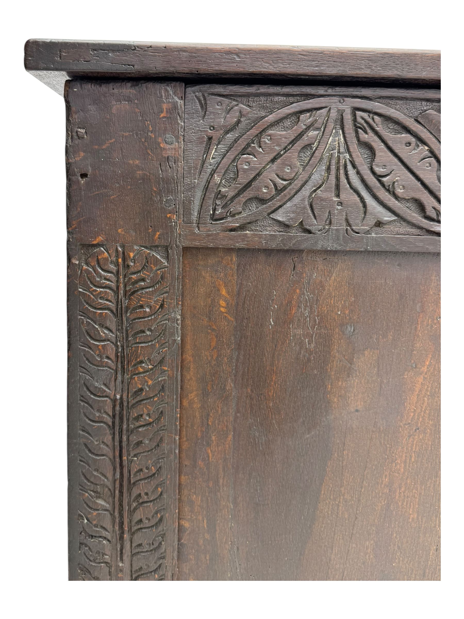 18th-century carved oak blanket chest with hand-carved floral and leaf motifs 