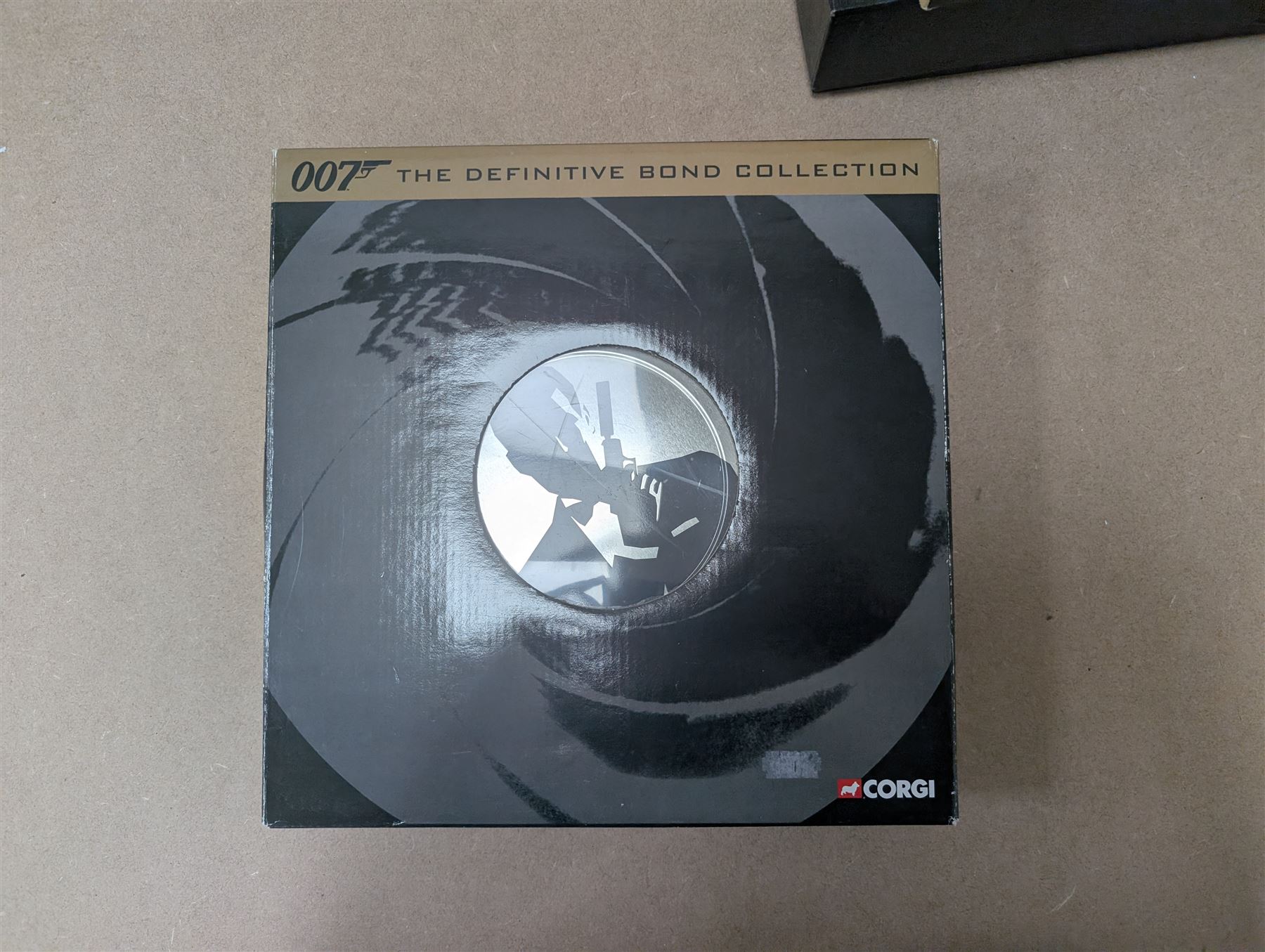 James Bond DVD collection, housed in a 007 collectors briefcase, together with Corgi The Definitive Bond Collection Film Canister 4 Piece Set CC99106, Corgi James Bond Space Shuttle CC04001 and a Vanguard RAC special limited edition diecast model set, all boxed