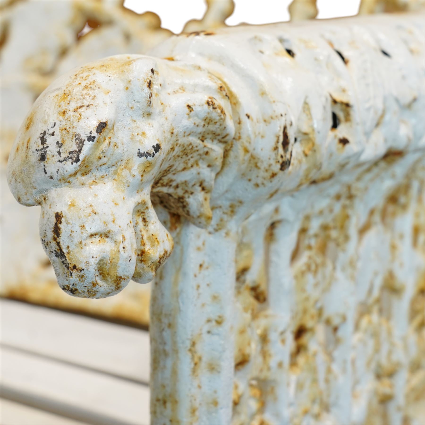 Coalbrookdale design - early 20th century cast iron oak leaf and acorn bench, white painted cast iron frame with slatted wooden seat, the pierced and shaped back decorated with scrolling oak branches and leafage, flanked by dog mask arm terminals over cabriole supports with paw feet 