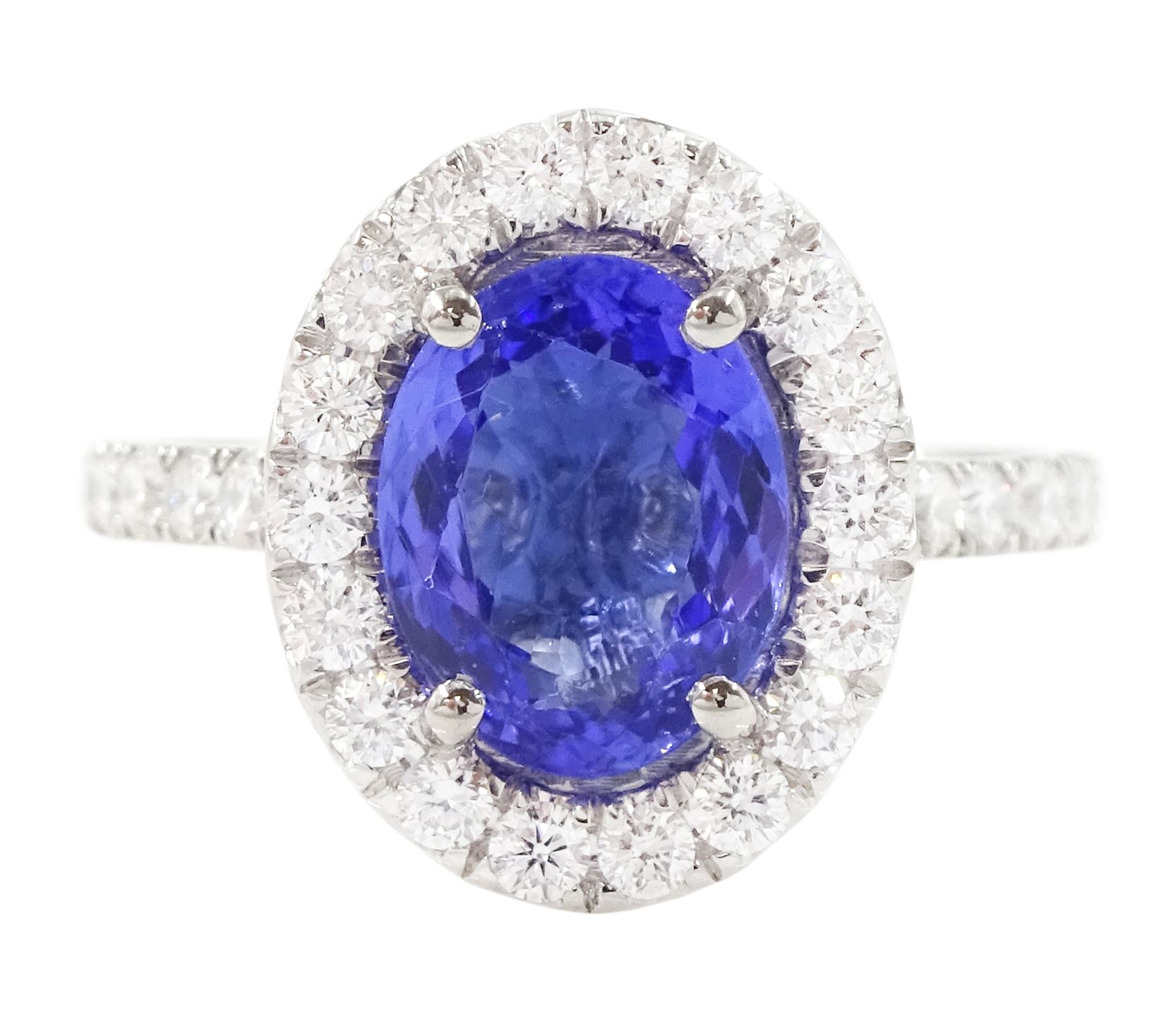 Platinum tanzanite and diamond cluster ring, single oval tanzanite of 2.36 carat, with round brilliant cut diamond surround and diamond set shoulders, hallmarked, total diamond weight 0.76 carat, with World Gemological Institute report