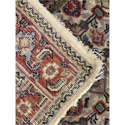 Persian-style wool rug, cream field with floral and geometric motifs, wide floral border (74cm x 142cm); Persian wool rug, beige field with dense floral patterns, narrow floral border (70cm x 144cm); Tribal wool rug, red and navy with diamond motifs (96cm x 60cm); Persian pictorial wool rug, black field with vase, birds, and floral border (70cm x 73cm)