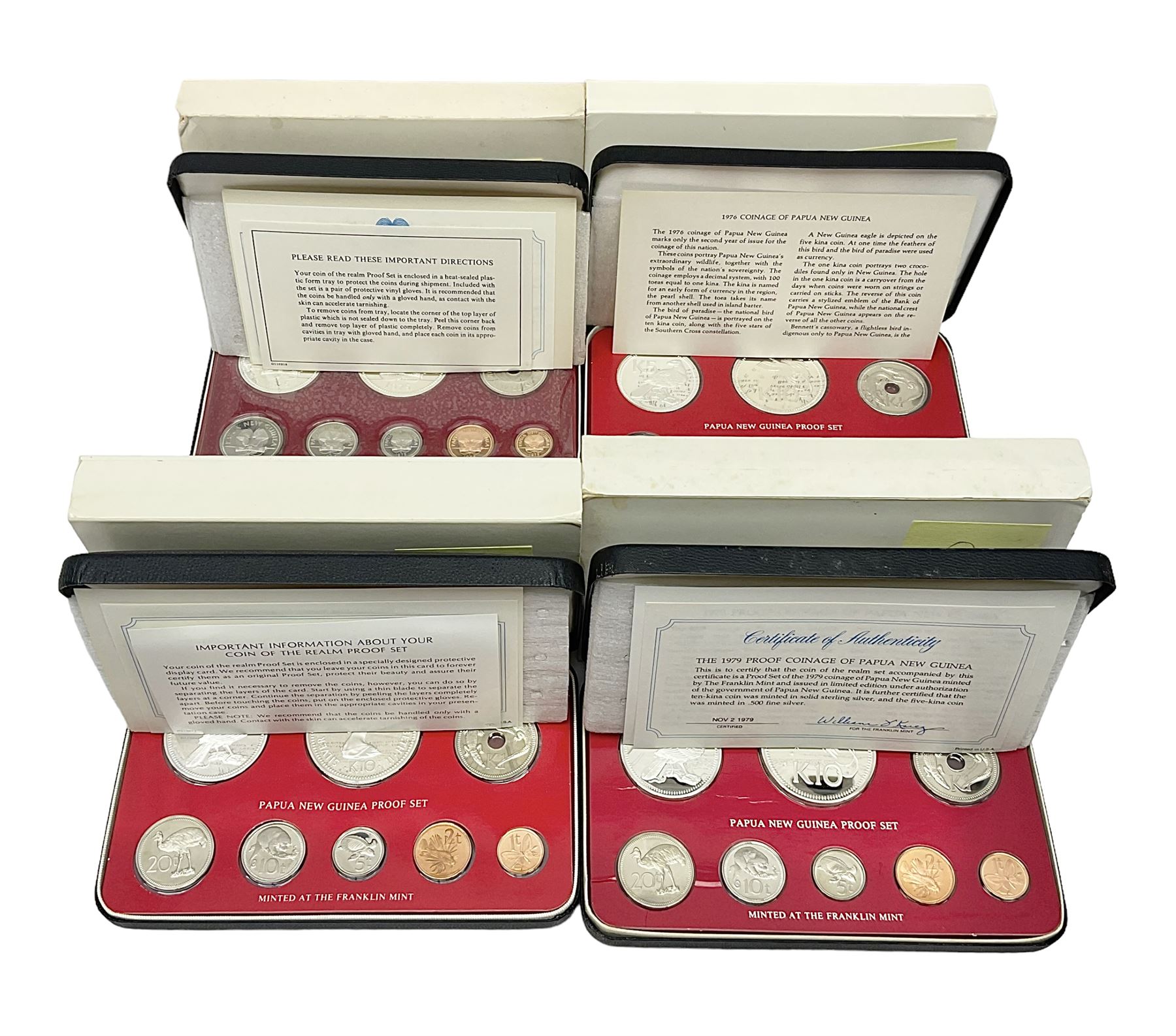 Four Papua New Guinea proof eight coin sets, from ten kina to one toea, comprising First Coinage of Papua New Guinea 1975 proof set, 1976, 1977, and 1979 proof sets, the 1977 and 1979 sets containing 925 silver ten kina and 500 silver five kina coins, all minted at the Franklin Mint, cased with certificates (4)