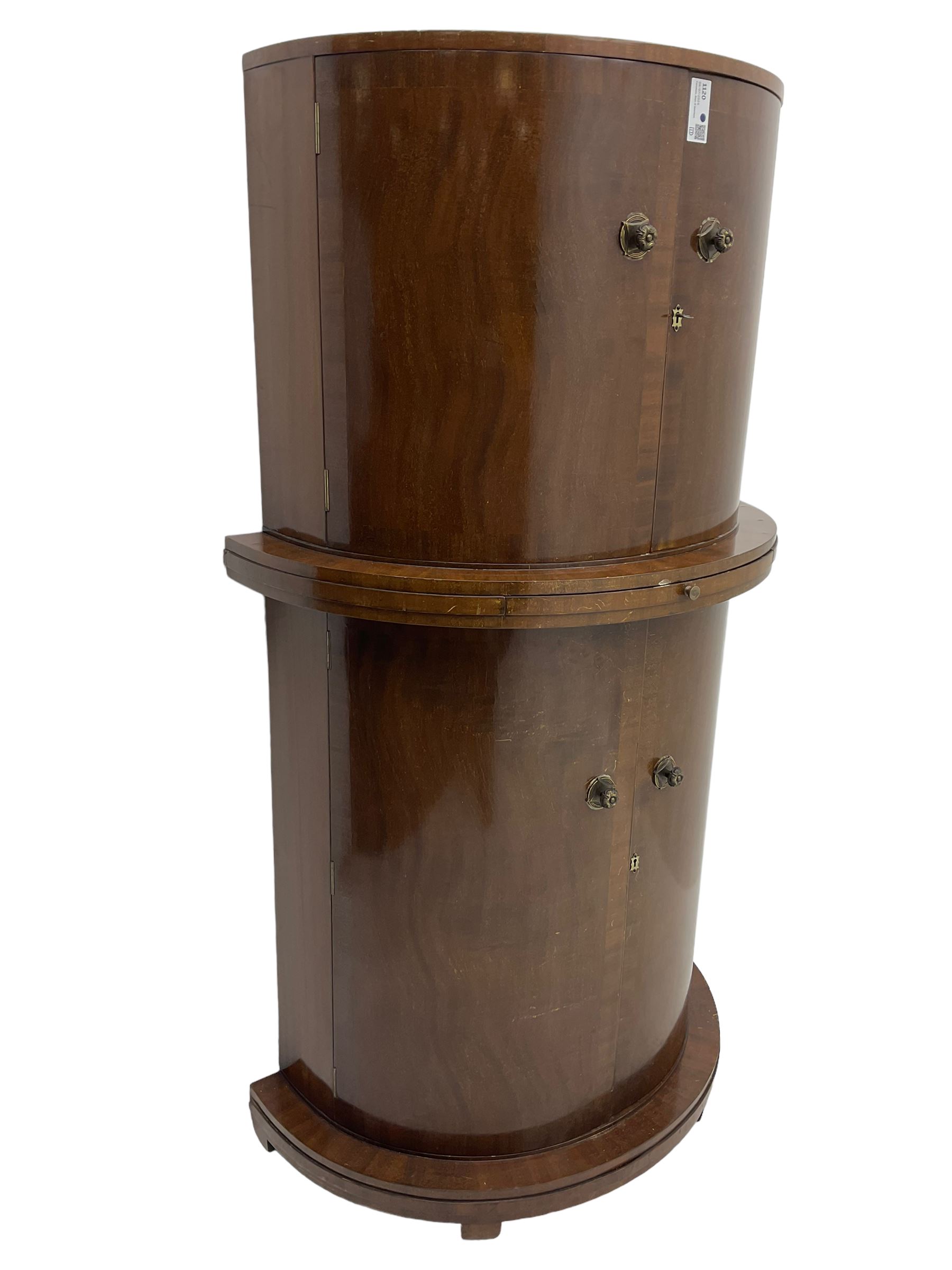 1930s Art Deco walnut demi-lune cocktail cabinet, enclosed by four curved doors, the upper section with mirrored interior, glass shelf and glass holders, the lower section fitted with shelves and bottle holders