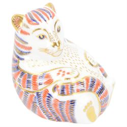 Four Royal Crown Derby paperweights, comprising Puffin, Squirrel, Badger, and Tiger Cub, each with silver stoppers