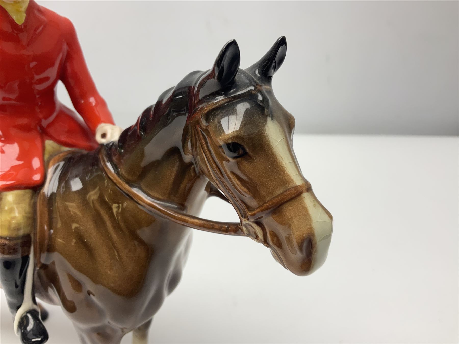 Beswick huntsman upon a bay horse no. 1501, with printed mark beneath, H22cm
