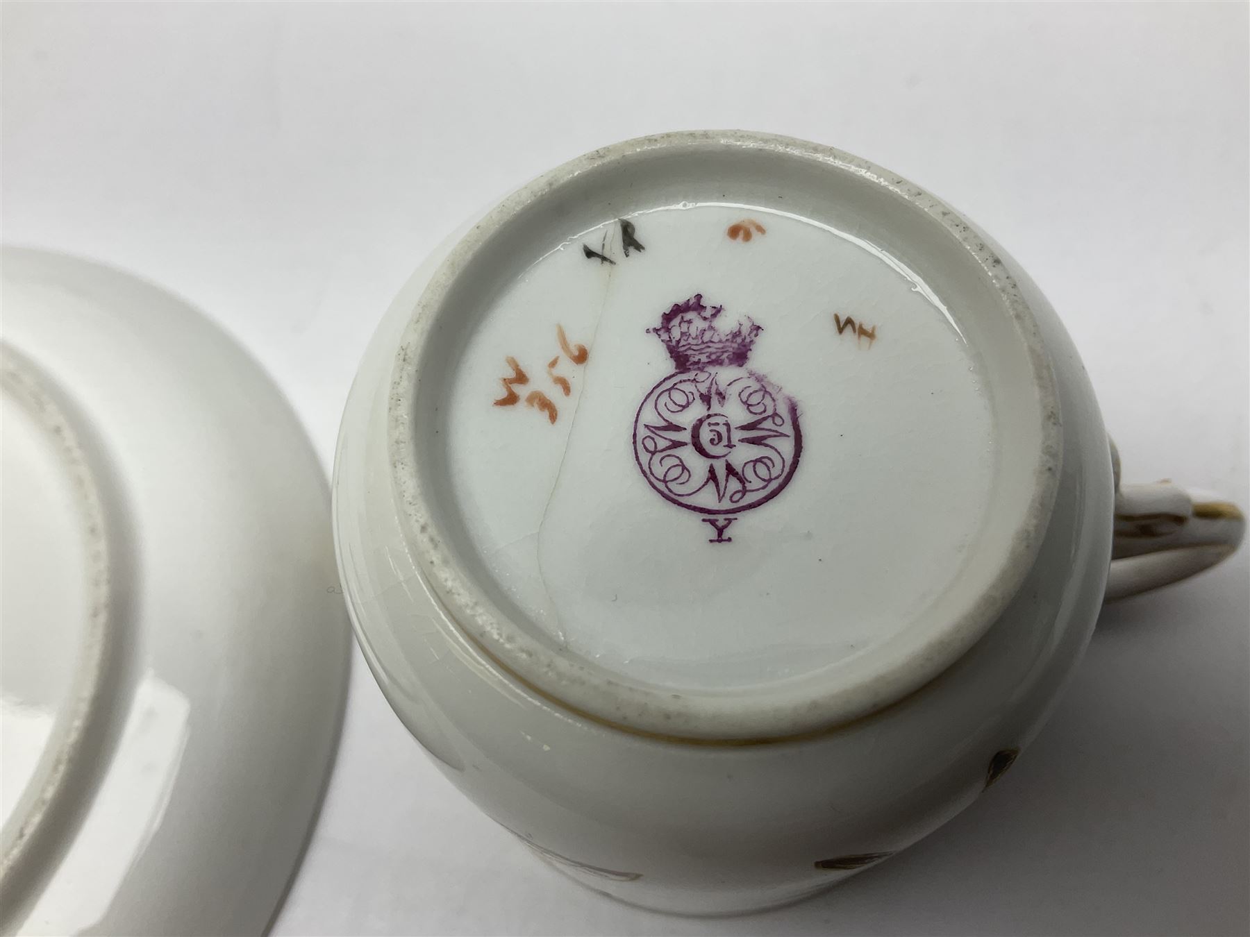 Royal Worcester coffee pot, coffee cup and saucer, all decorated with floral sprigs and butterflies, the coffee pot with a bamboo handle, H23cm
