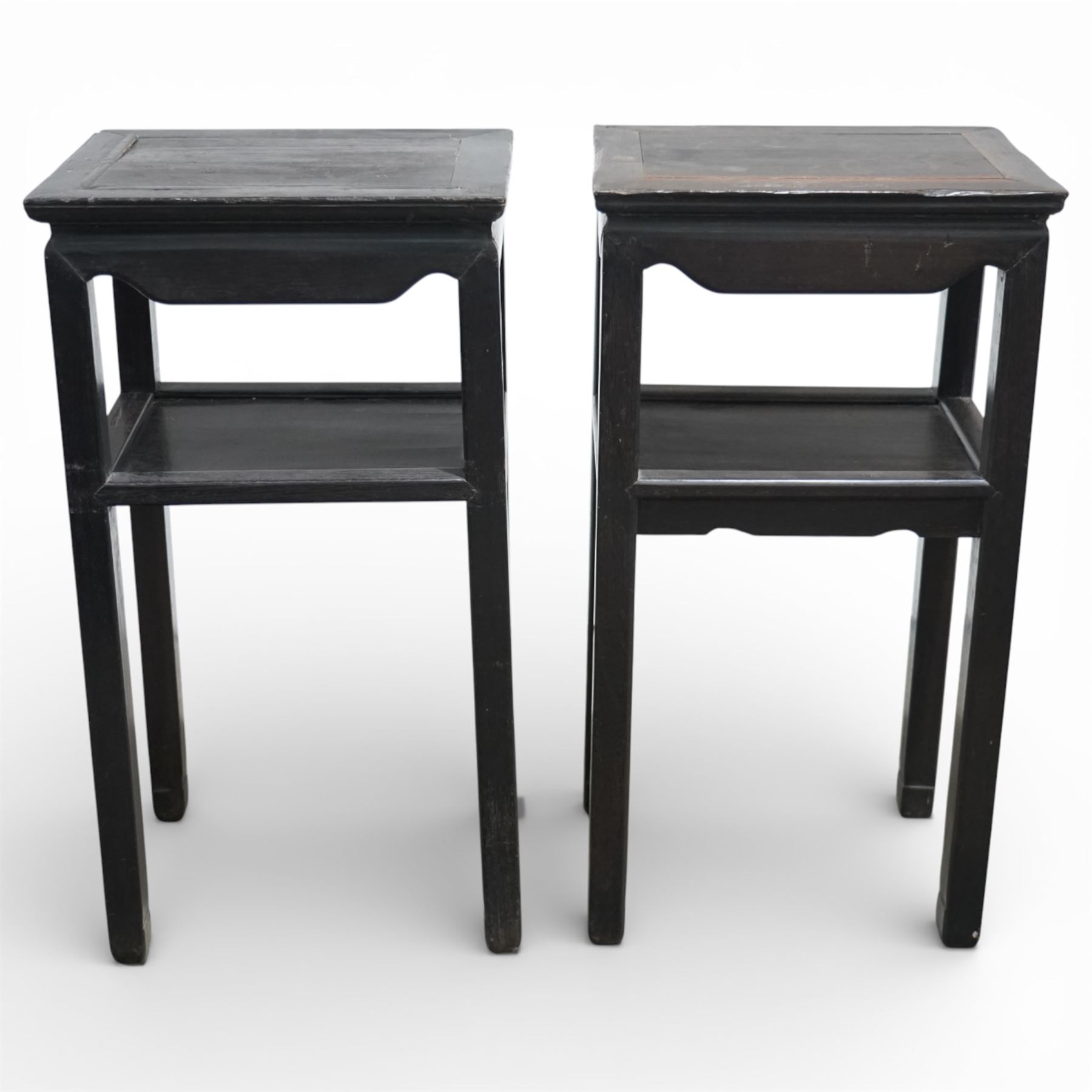 Near pair of 19th century Chinese hardwood stands, each with rectangular tops above plain friezes, open undershelves, square section legs joined by stretchers, black lacquered finish