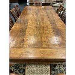 Large teak dining table, moulded rectangular top, on cabriole supports, together with a set of ten ladder back dining chairs with cane work seats