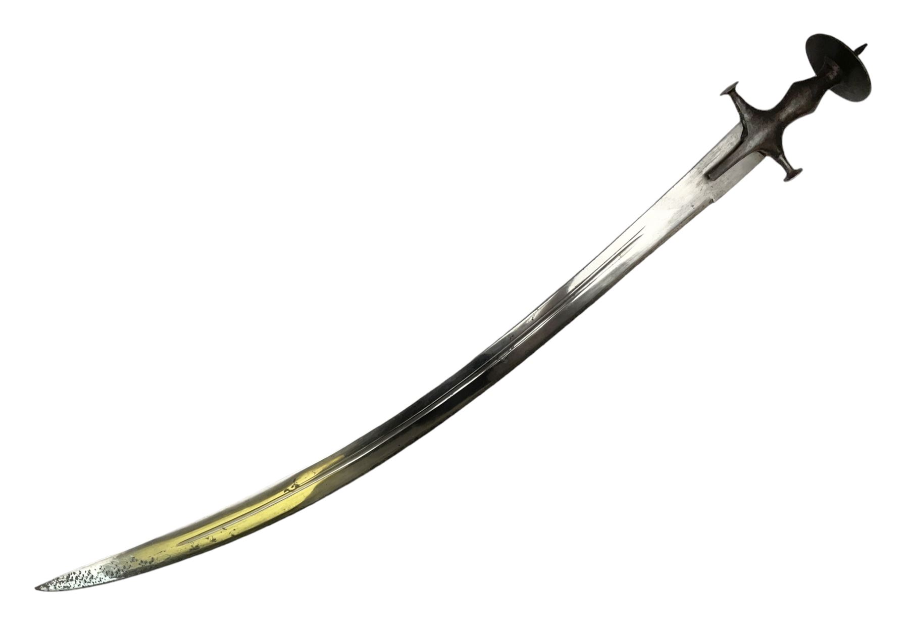 19th Century Indian Tulwar sword with 77cm single edged, slightly curved fullered blade;  steel crossguard, langets, grip and spiked disc pommel with stiff leaf decoration L90cm overall