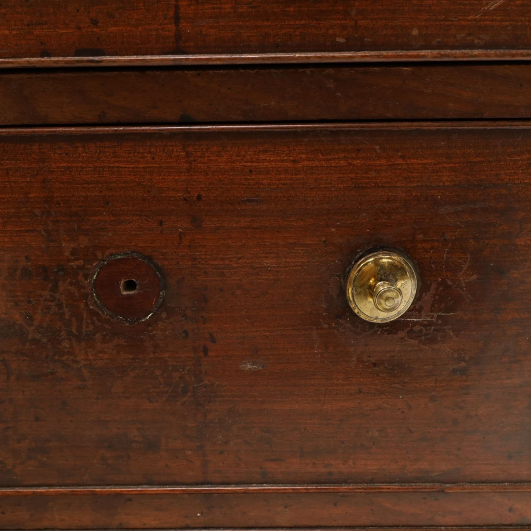 George III mahogany bureau of large proportions, the fall-front enclosing fitted interior with fluted column secret compartments and assorted pigeonholes and correspondence drawers flanking central cupboard, over four graduating cock-beaded drawers with original brass swan-neck handles, raised on bracket feet