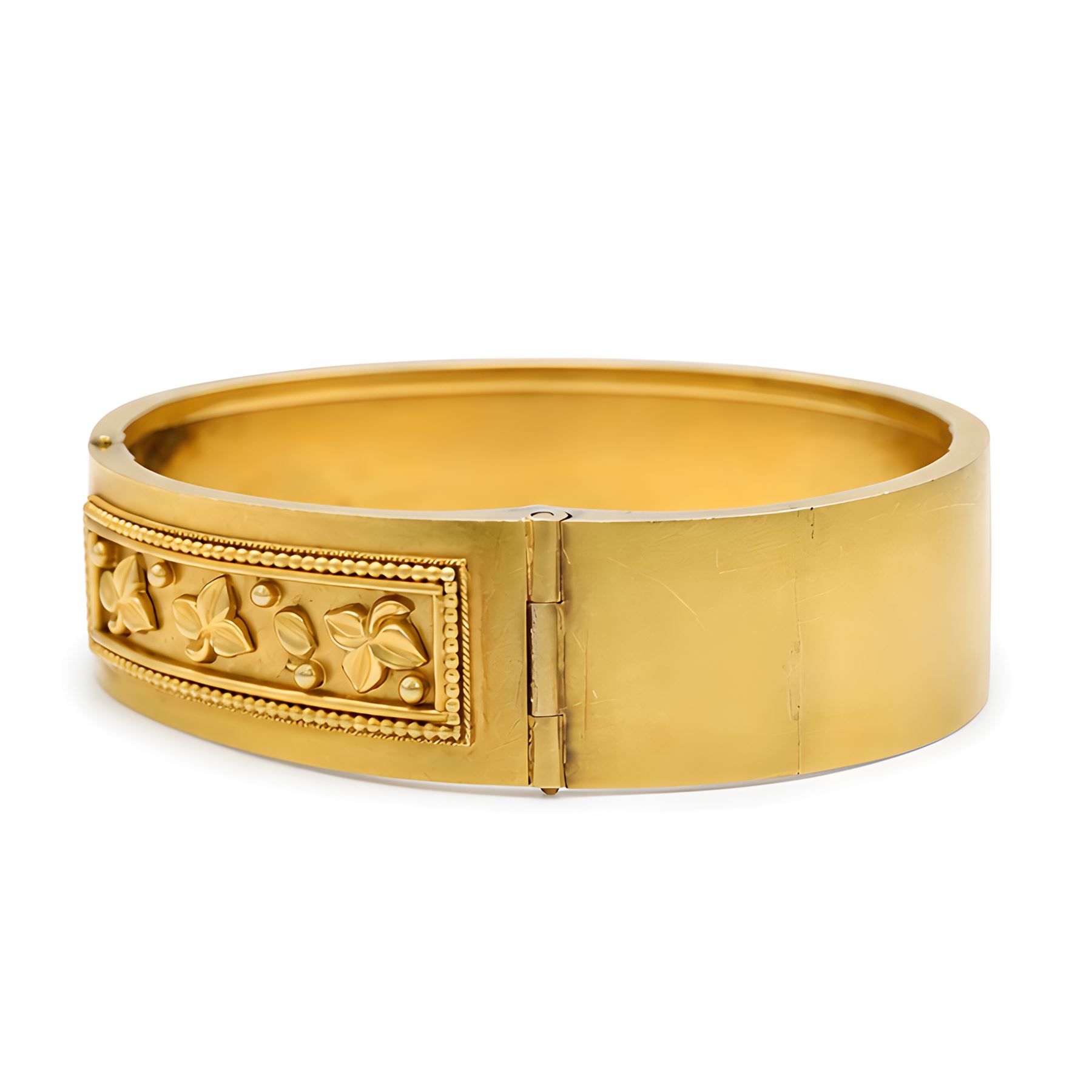19th / early 20th century gold hinged bangle, with applied ivy leaf, bead and wirework decoration