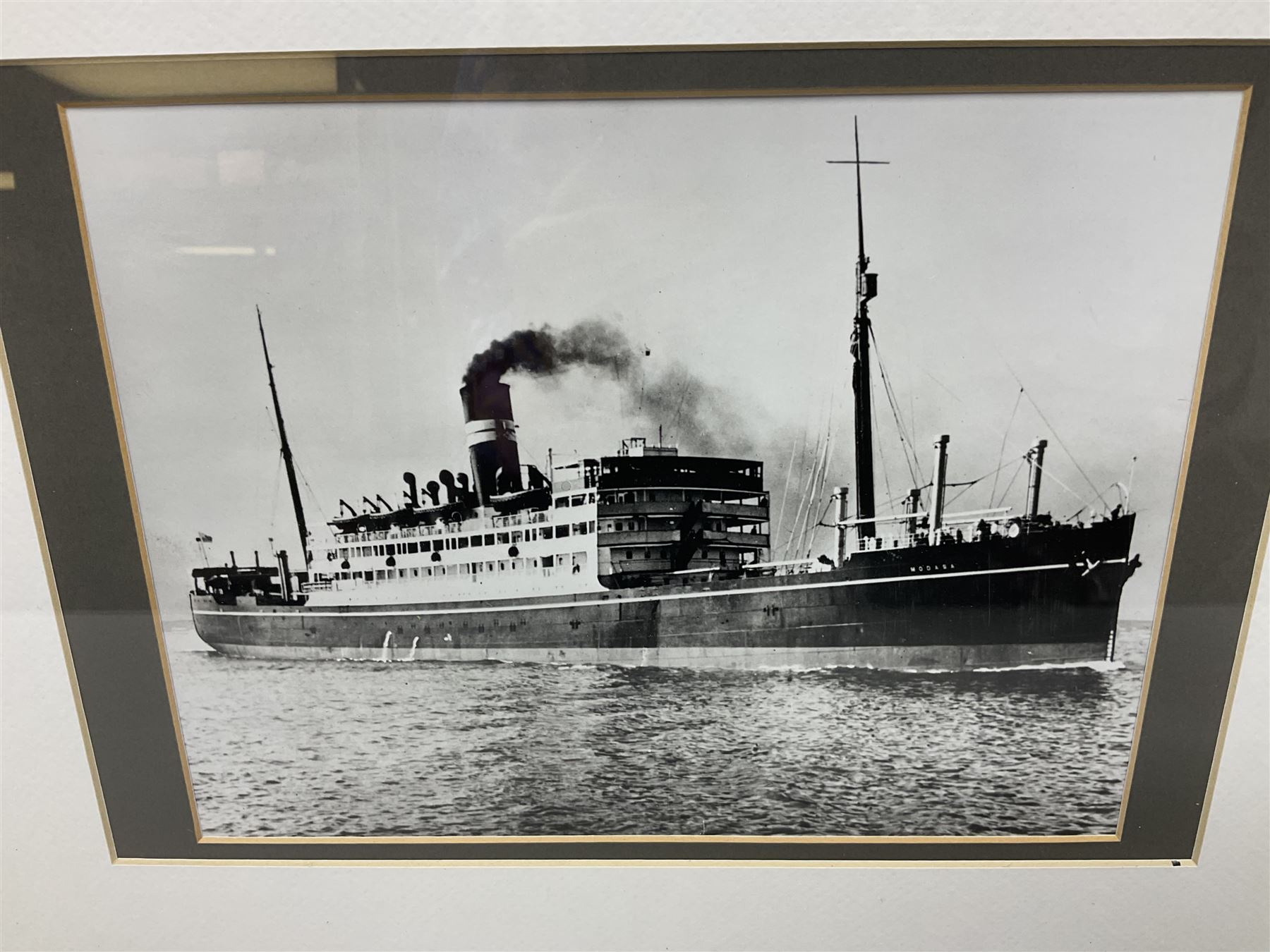 Set of twelve monochrome photographs of mid-20th century merchant vessels comprising general cargo ships, cargo liners, RMMV passenger cargo liners and hospital ship including Rowallan Castle, Drakensberg Castle, Stirling Castle, Capetown Castle, Pachumba, Tilapa etc; average size 18 x 24cm; uniformly mounted in black frames (12)