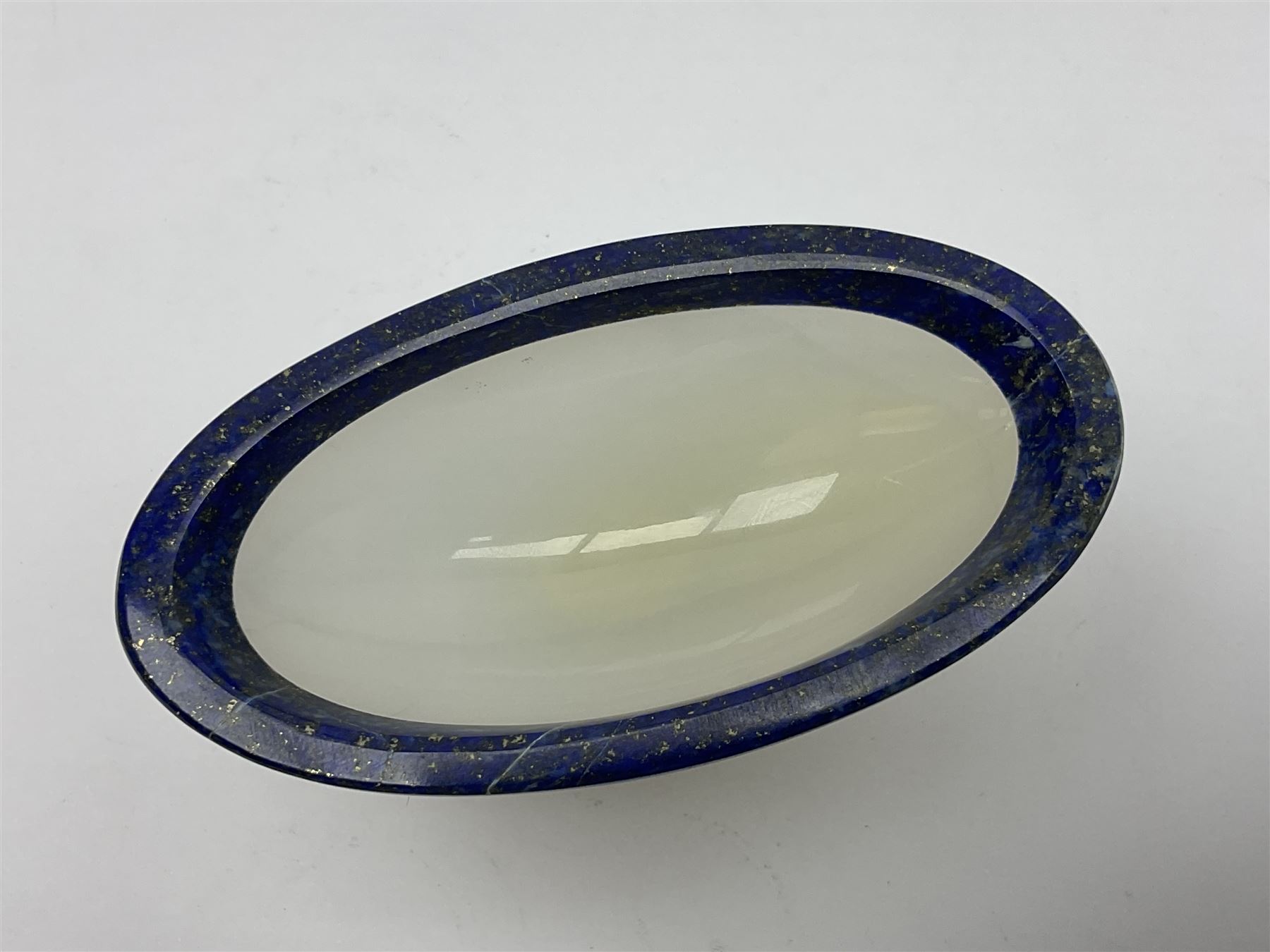 Pair of lapis lazuli and agate open salts, of navette form, upon a stepped oval pedestal foot, H5cm, L8cm