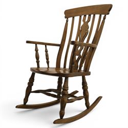 Farmhouse elm rocking chair, high back with 'Fleur De Lis' splat, shaped arms above turned supports, on rocker base 
