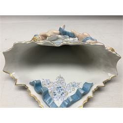 Continental wall pocket applied with two putti and ribbons and decorated with blue and gilt flowers H32cm