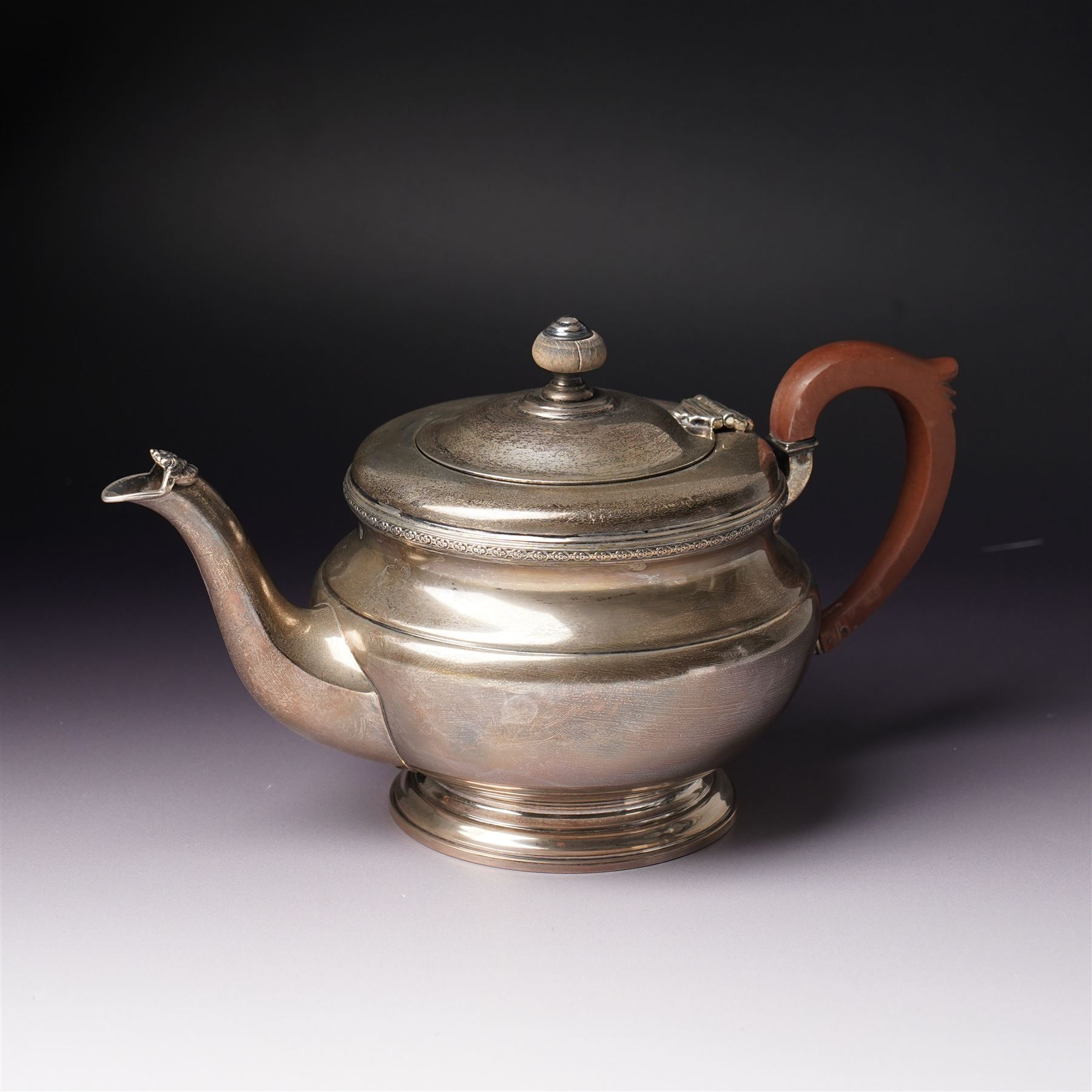 Silver circular teapot with stained wood handle and lift Birmingham 1933 Maker Adie Bros. Ltd