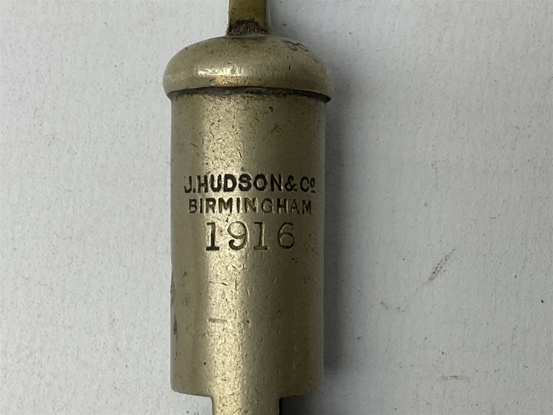 Three J Hudson & Co Birmingham military whistles, dated 1915, 1916, 1923