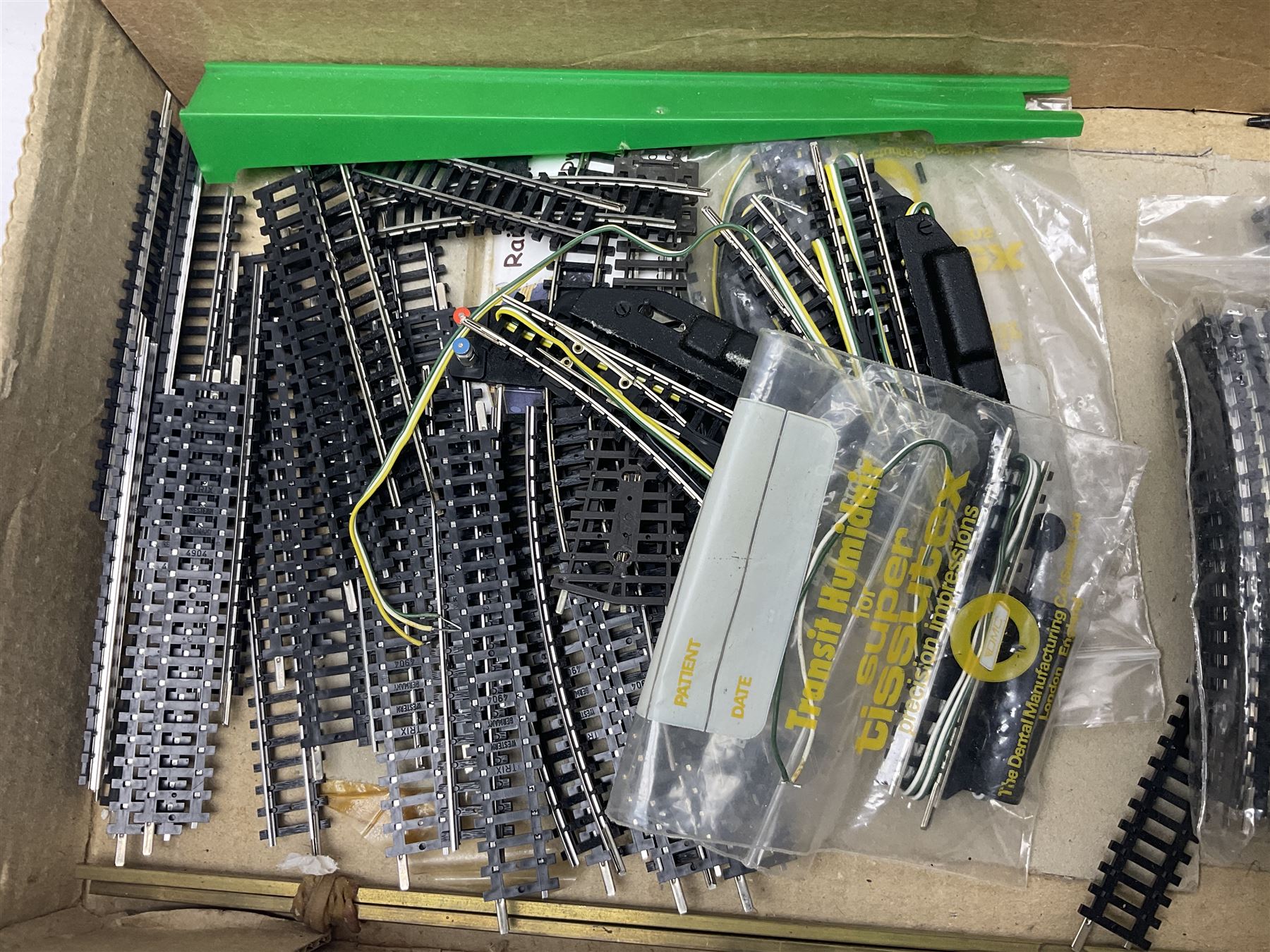 Quantity of loose unused 'N' gauge track; H. & M. Powermaster Variable Transformer Unit, Model R.C.1 Rectifier Controller, Selector Switch Unit and Meter Unit; all boxed; and small quantity of booklets