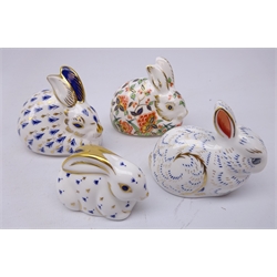  Four Royal Crown Derby Rabbit paperweights: Meadow Rabbit & Bunny designed exclusively for the Royal Crown Derby Collectors Guild dated 1998 & 2004 and two other Rabbits, three gold & one silver stopper (4)  