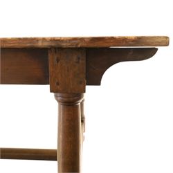 Large oak and pine farmhouse table, with pine plank top raised on and oak base with turned supports united by a long stretcher 