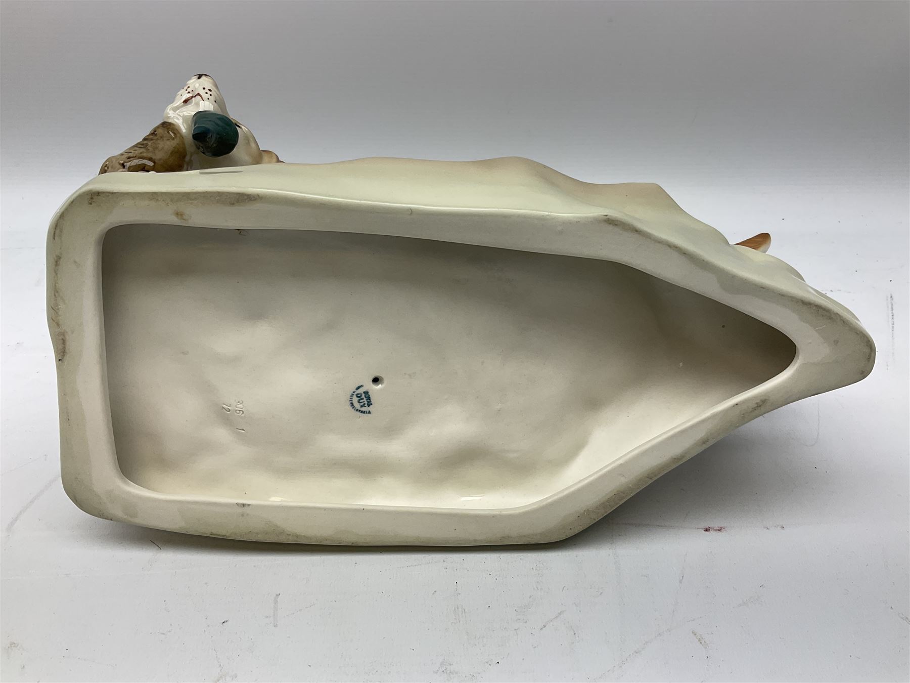 Royal Dux porcelain hunting dog with a bird, printed mark beneath, L36cm