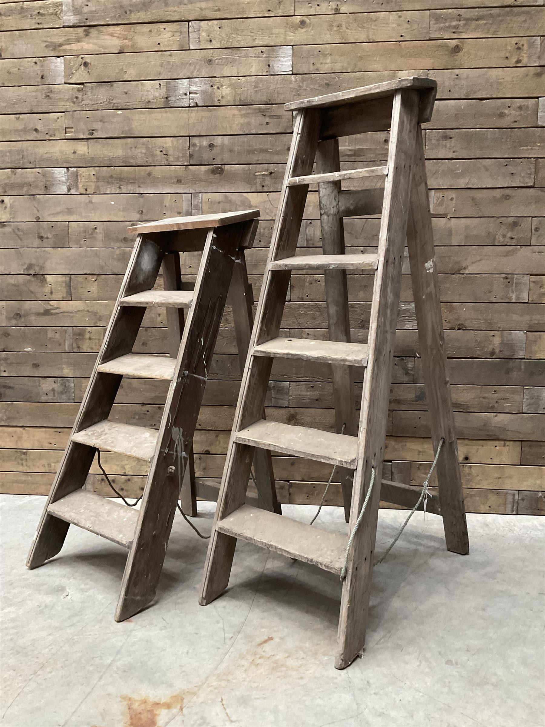 Two antique wooden step ladders, H100cm and 140cm