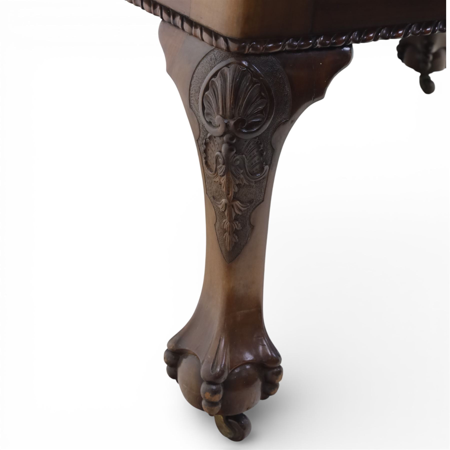 19th century mahogany extending dining table and eight chairs, rectangular top with rounded corners and additional leaves, plain frieze with carved gadrooned edge detail, raised on cabriole supports terminating in ball and claw feet, together with a set of eight mahogany dining chairs including two carvers, the chairs with curved top rails and pierced splats, upholstered drop-in seats, on turned supports

(Table extends to 312cm)