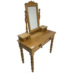 Waxed pine dressing table, raised rectangular swing mirror over small trinket drawers, fitted with two drawers, on turned supports 