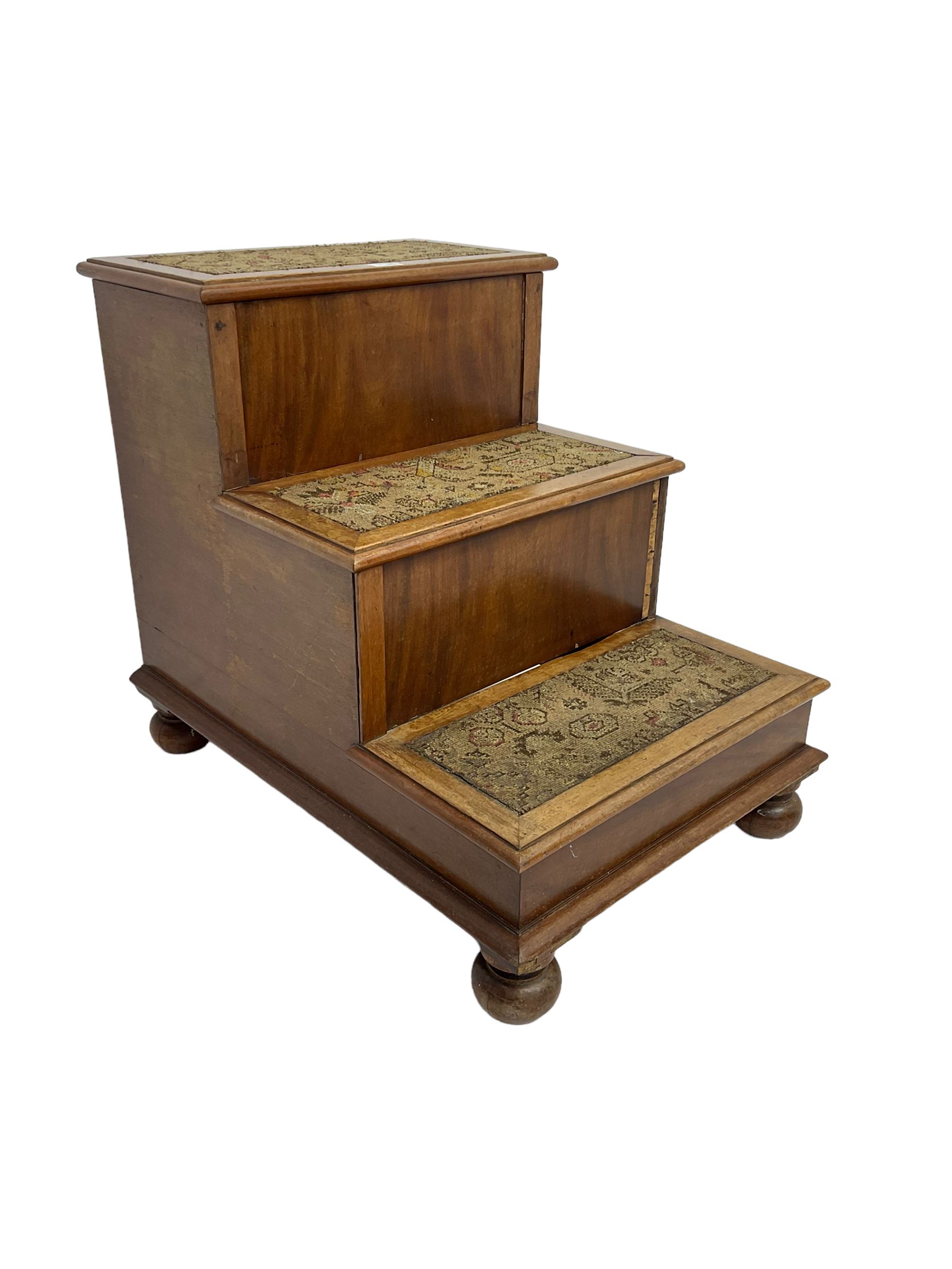 19th century mahogany step commode, pull-out action to reveal commode, the top with hinged lid, on turned feet