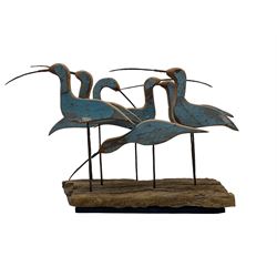 John Thornton (Northern British 1944-): 'Seven Birds Wading', carved and painted driftwood sculpture, signed and titled to the base H35cm W56cm D19cm