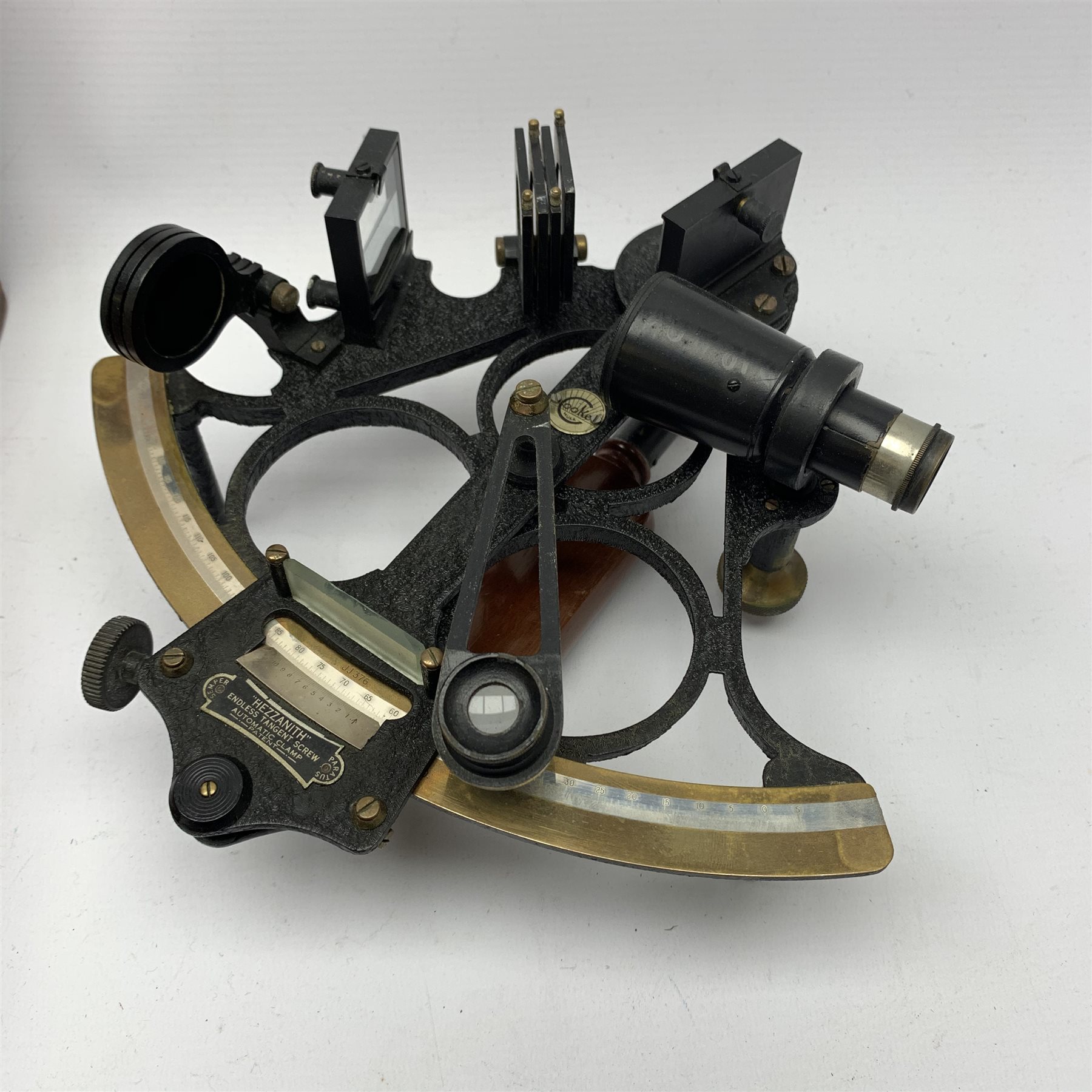 Heath & Co 'Hezzanith' sextant, pattern 491.V., with black crackled framework, brass arc with silvered scale, endless tangent screw and automatic clamp, bears label 'Cooke Hull', serial no.JJ375, in fitted mahogany box with additional lenses and Certificate of Examination dated October 1964. Inset plaque to box lid inscribed 'Cadet Capt. D.J. Walker H.S.N.T. 1983 - 84'. Provenance: Captain Walker was later in command of the North Sea Ferries ship Norland and the vendor is his widow.