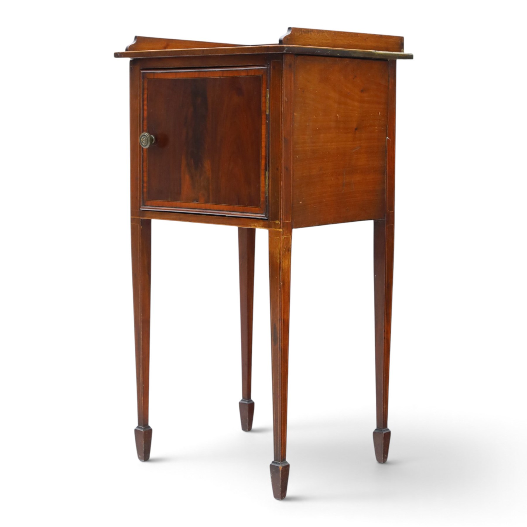 Edwardian mahogany pot cupboard, with three quarter galleried top, single cupboard door, raised on square tapering supports terminating in spade feet