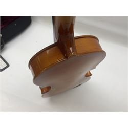 Four Chinese graduated violins - full size with 35.5cm two-piece back; three-quarter size with 33.5cm two-piece back; half size with 31cm two-piece back; and quarter size with 27.5cm two-piece back; all cased except full size; one with bow (4)